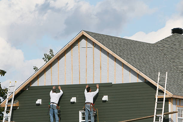 Professional Vinyl Siding technician working in Saint James, NY
